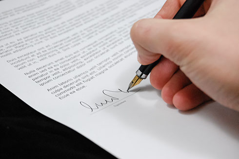 Person signing papers